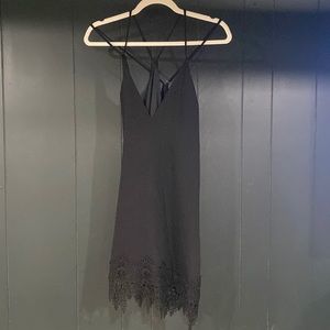 Black mini dress, low cut strappy back